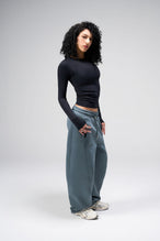 Side View Of Women's Essential Seamless Long Sleeve Top in Black