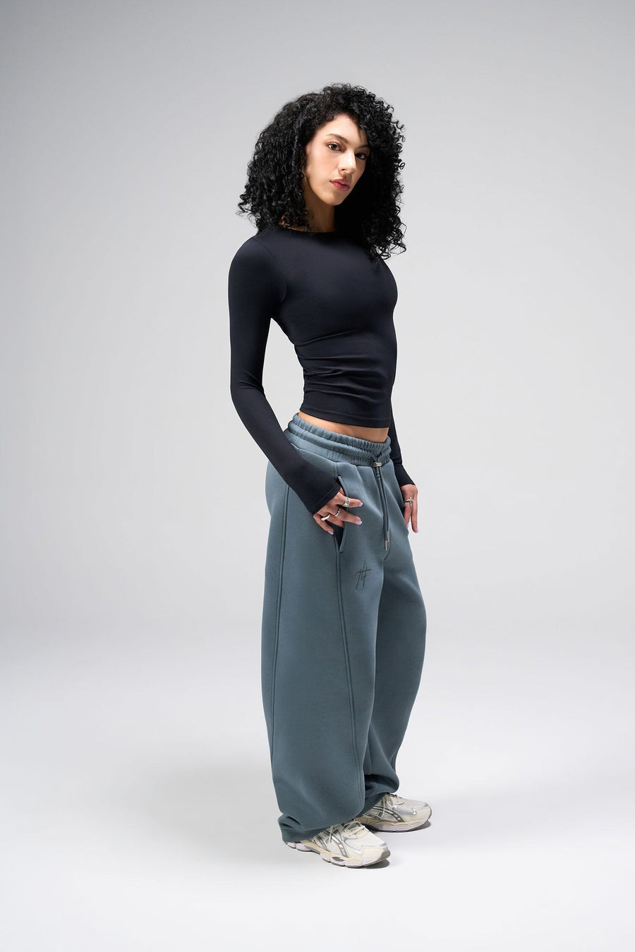 Side View Of Women's Essential Seamless Long Sleeve Top in Black