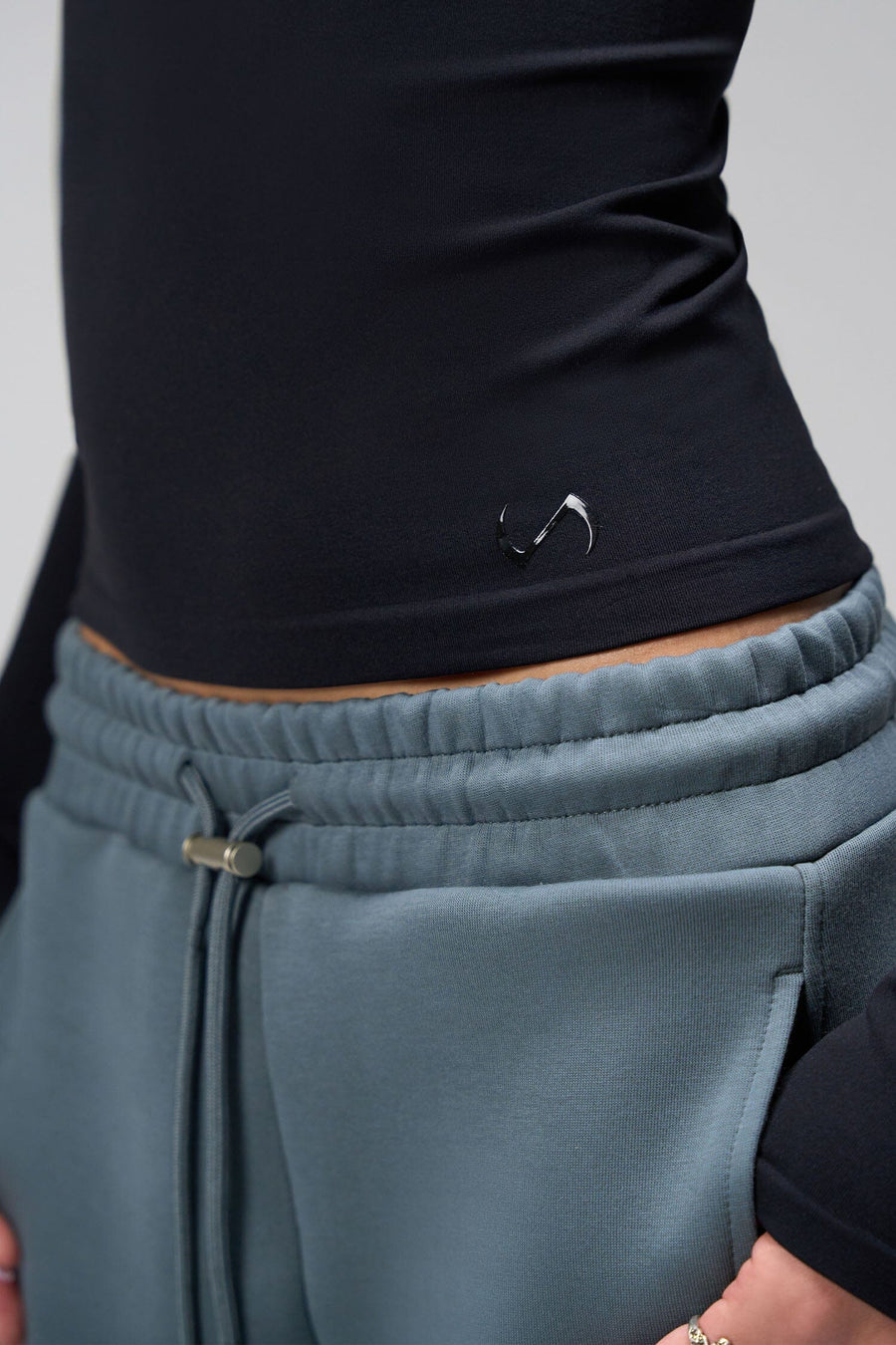 Side View Of Women's Essential Seamless Long Sleeve Top in Black