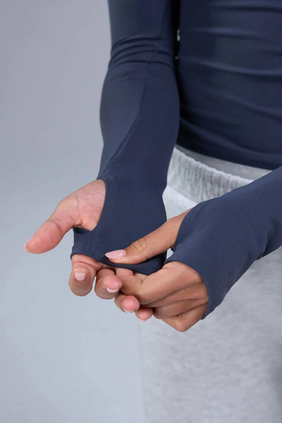 Detail Sleeves View of Blue TLF Essential Seamless Reversible Scoop Neck, featuring thumbholes and multi wear for boat neck or scoop neck styling 