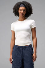 Front View of White the TLF Fitted Crew Neck T-Shirt featuring a long line silhouette and whip stitch detailing. 