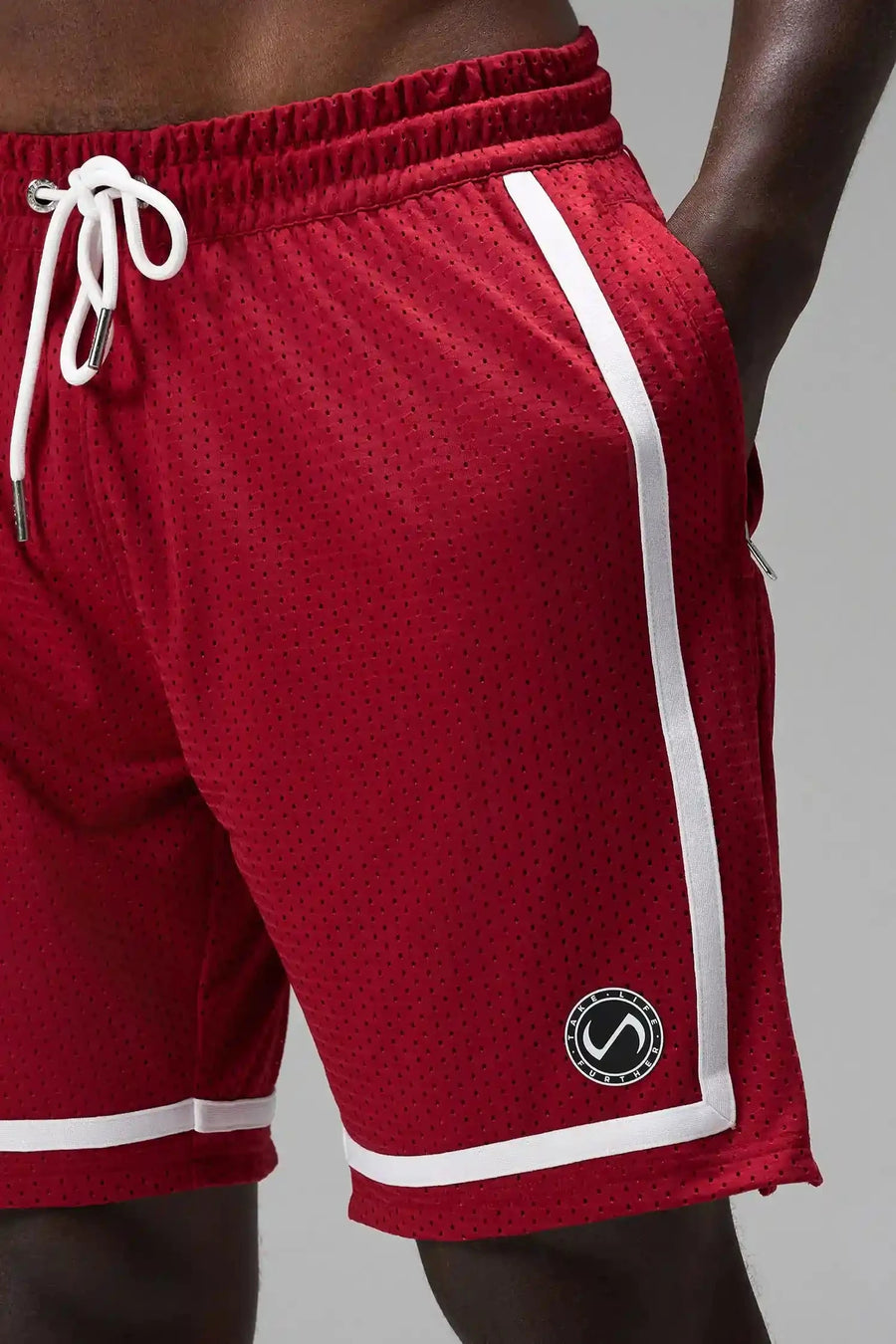 Detail Front View of Red GTS Athletic 8 Inch Shorts, featuring an 8-inch inseam and zipper pockets