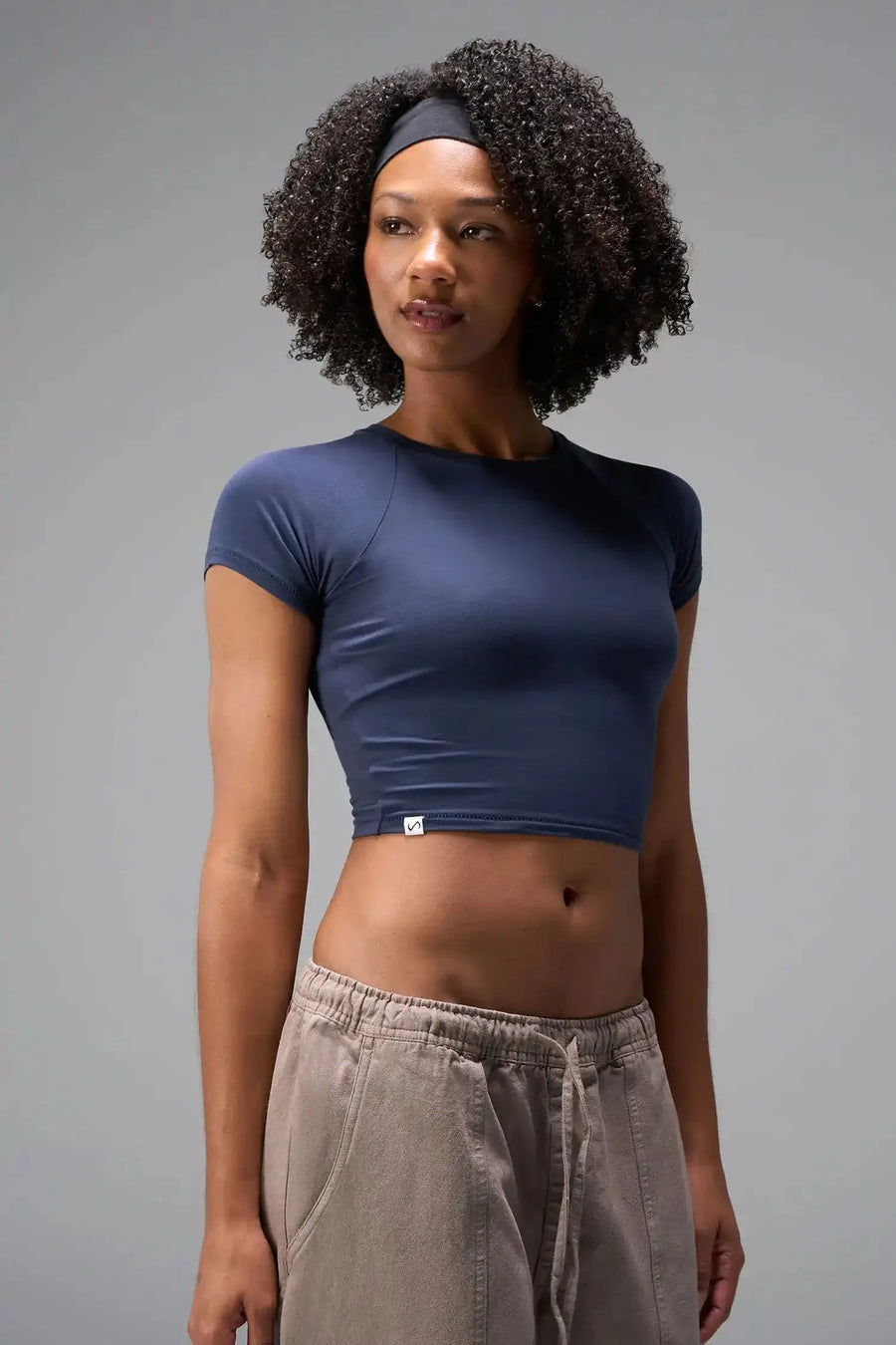 Front View of Blue the TLF GTS Cropped Baby Tee features sporty raglan sleeves, cropped length and premium whip stitch detailing. 