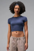 Front View of Blue the TLF GTS Cropped Baby Tee features sporty raglan sleeves, cropped length and premium whip stitch detailing. 