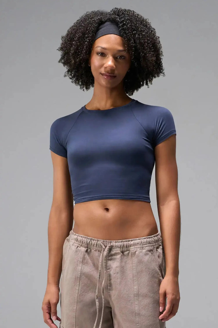Front View of Blue the TLF GTS Cropped Baby Tee features sporty raglan sleeves, cropped length and premium whip stitch detailing. 