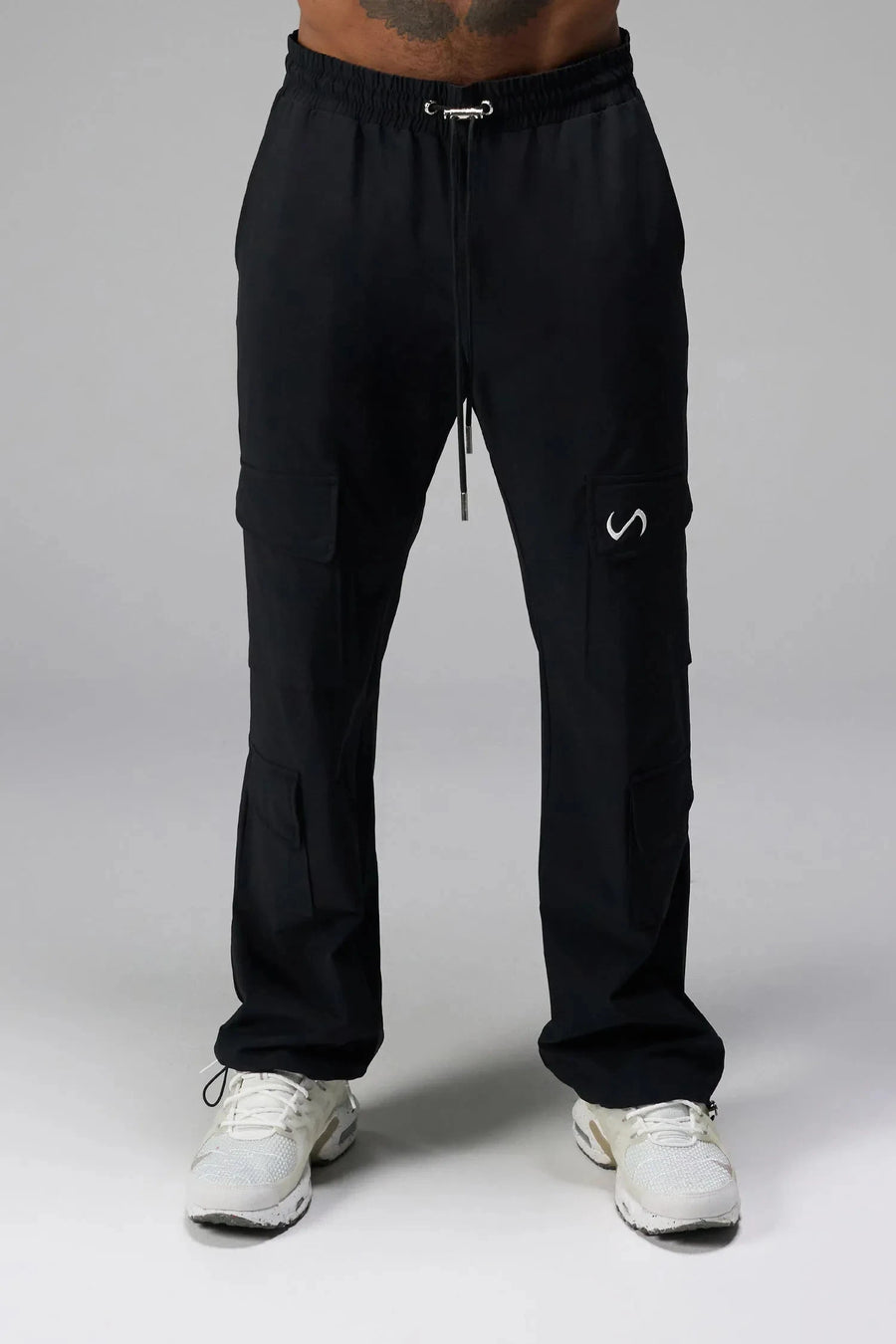 Detail View of Black the TLF GTS Element-Max Cargo Pants featuring front cargo pockets and an adjustable ankle drawcord ankle for custom fit