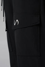 Detail View of Black the TLF GTS Element-Max Cargo Pants featuring front cargo pockets and an adjustable ankle drawcord ankle for custom fit