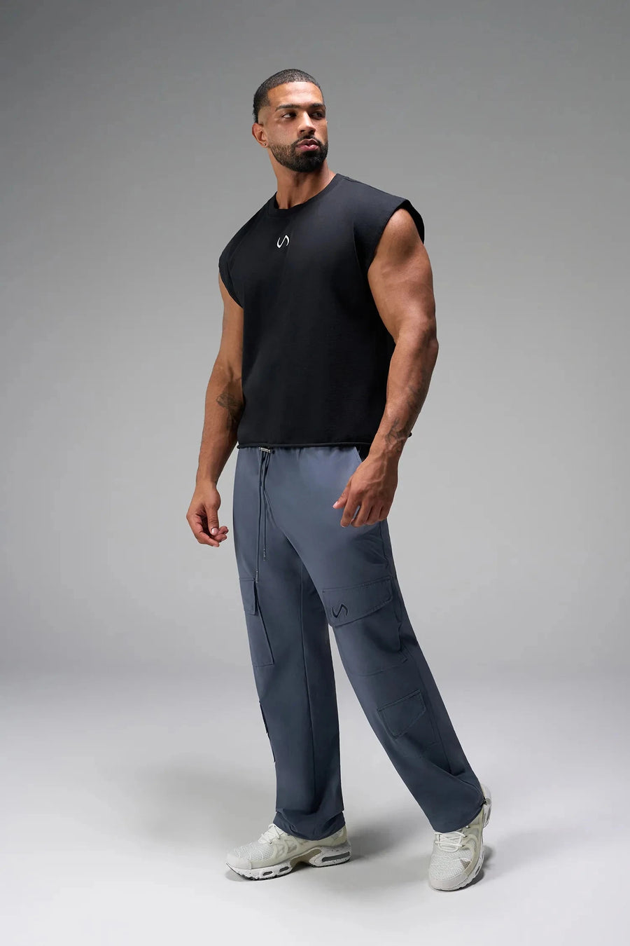 Front View of Blue the TLF GTS Element-Max Cargo Pants featuring front cargo pockets and an adjustable ankle drawcord ankle for custom fit