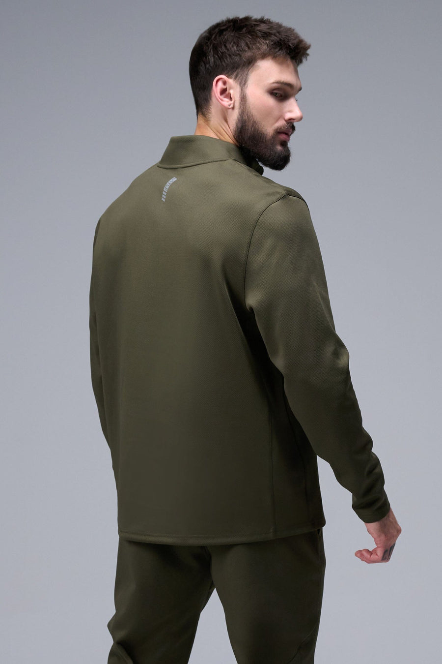 Detail Front View of Marshland TLF GTS Quad Tech Quarter-Zip Pullover redefining modern activewear, this men’s 1/4 zip pullover blends technology with sleek style 