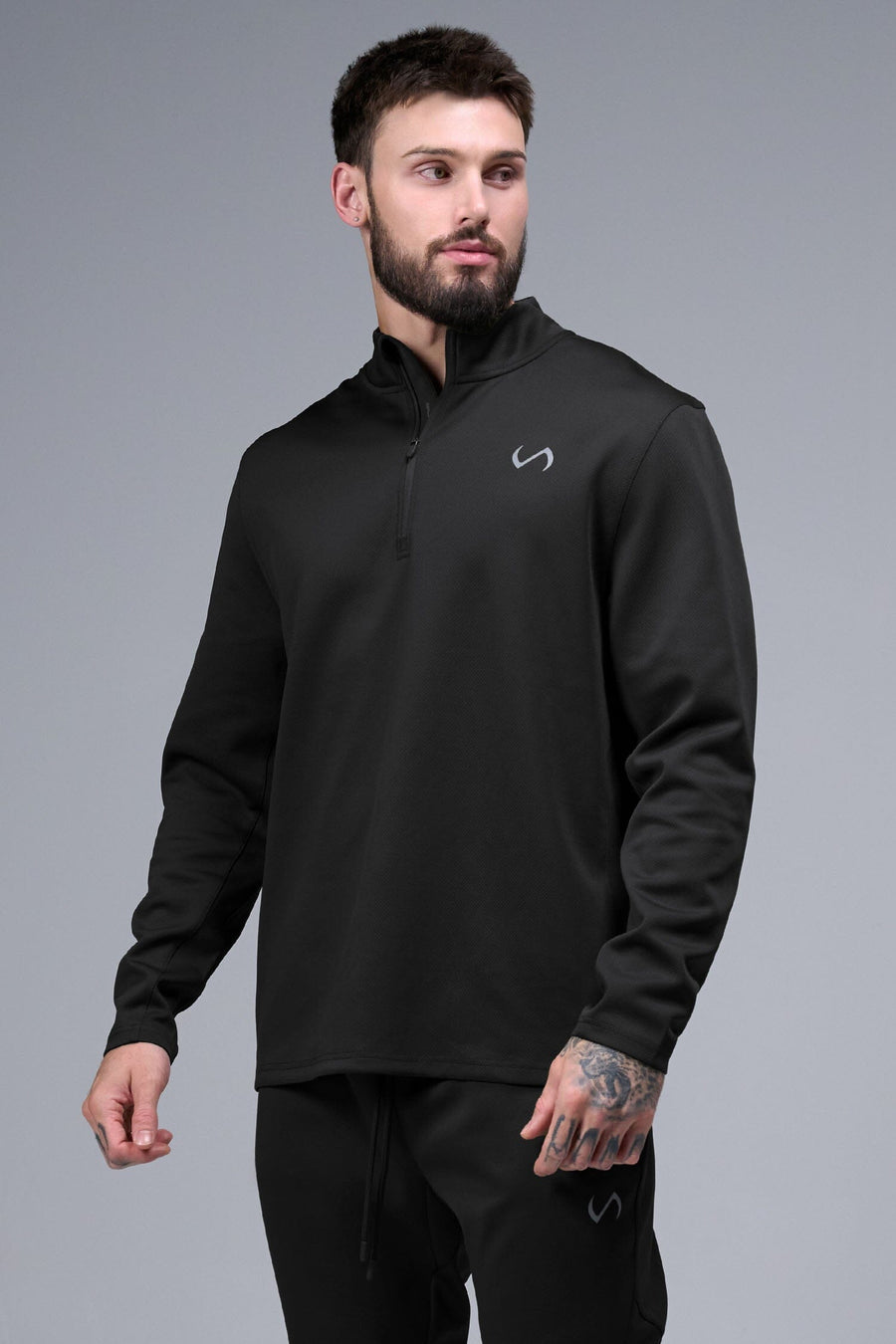Front View of Black TLF GTS Quad Tech Quarter-Zip Pullover redefining modern activewear, this men’s 1/4 zip pullover blends technology with sleek style 