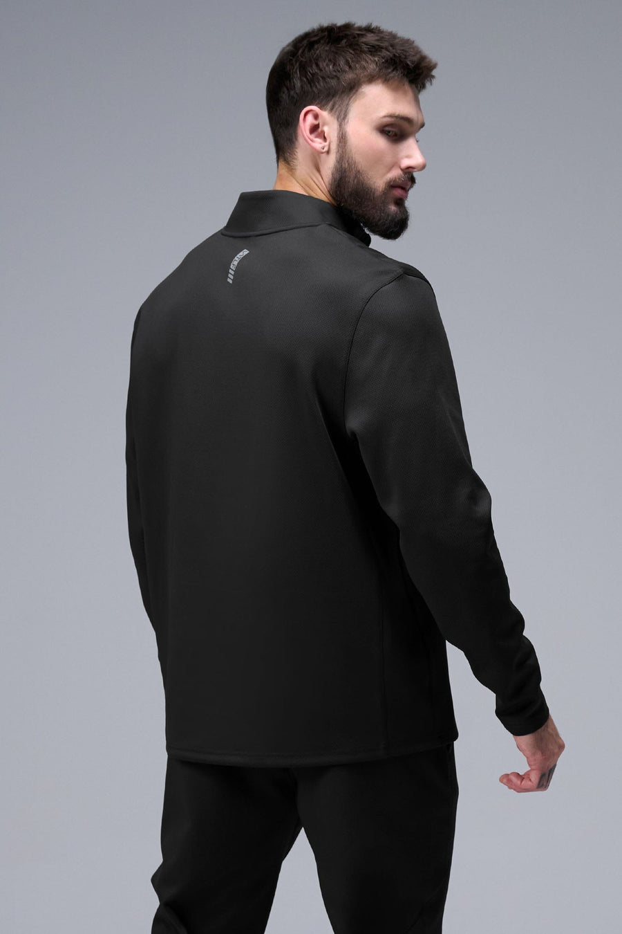 Back View of Black TLF GTS Quad Tech Quarter-Zip Pullover redefining modern activewear, this men’s 1/4 zip pullover blends technology with sleek style 