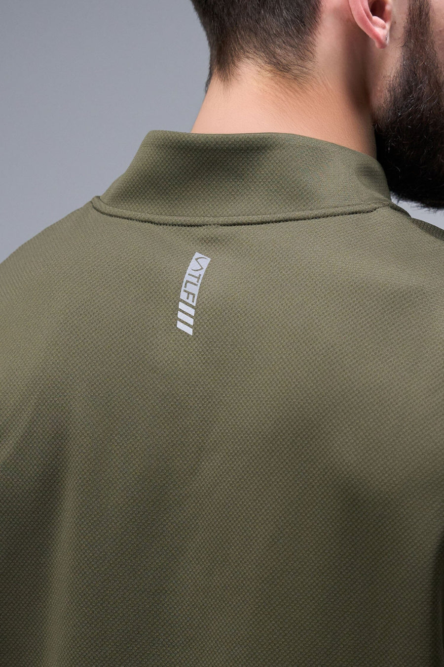Detail Back View of Marshland TLF GTS Quad Tech Quarter-Zip Pullover redefining modern activewear, this men’s 1/4 zip pullover blends technology with sleek style 