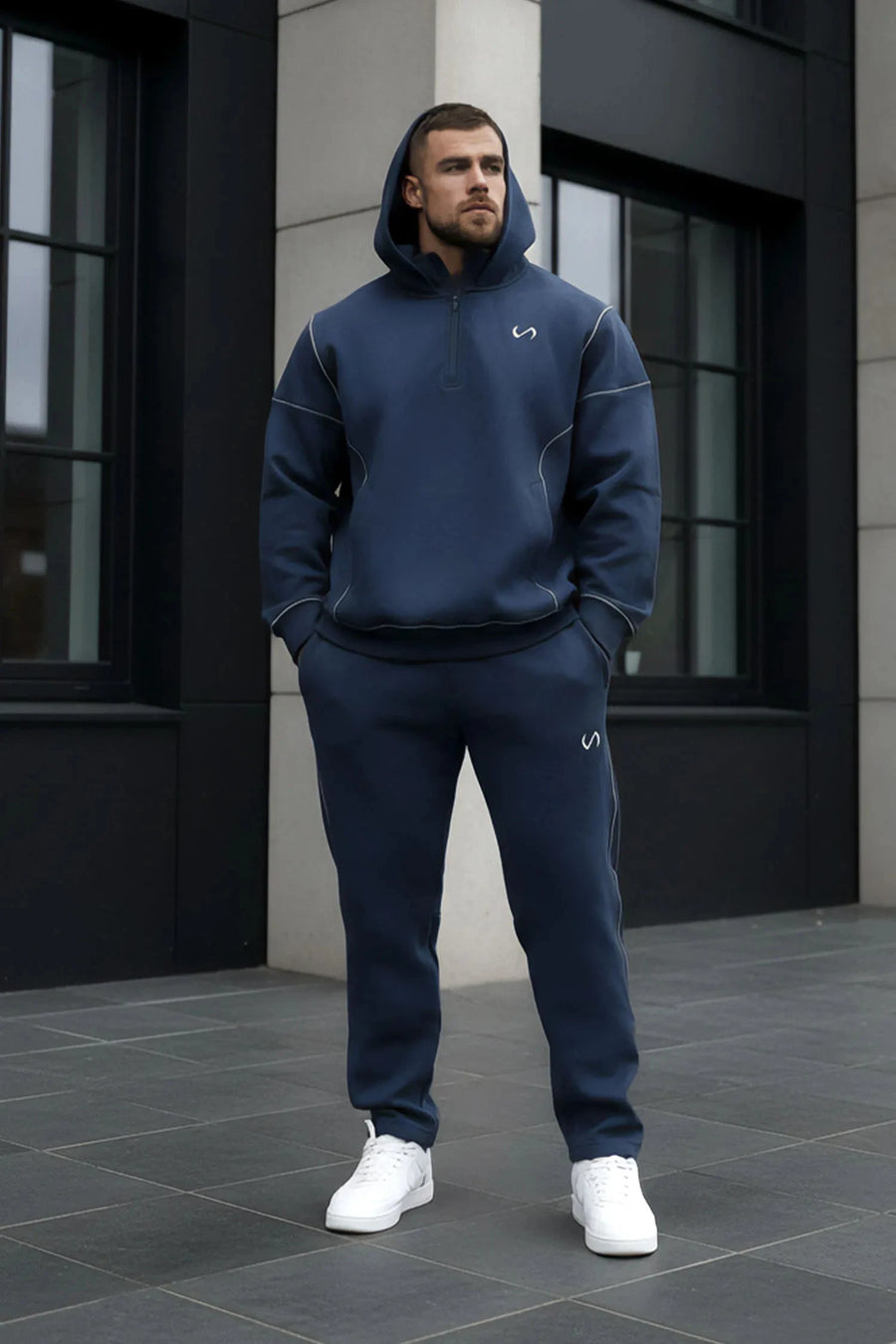 Front View of Blue TLF GTS Twill Tech Joggers, featuring contrast stitching, zippered pockets, and next level style and function
