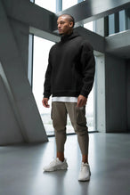 Black TLF GTS Twill Tech Quarter-Zip Hoodie — product video showing the quarter-zip collar, contrast stitching and kangaroo pockets