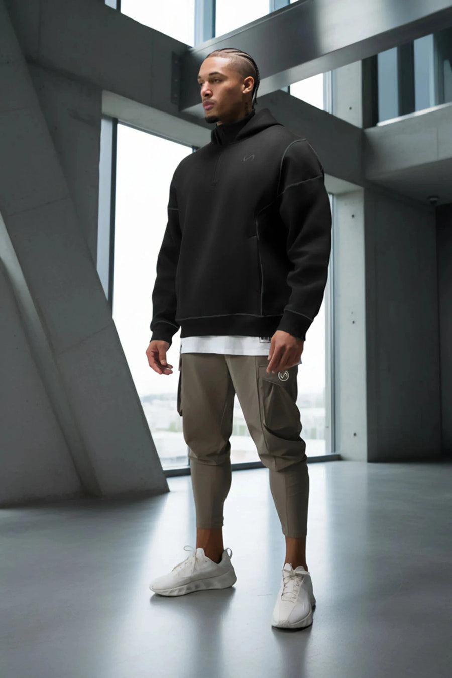 Black TLF GTS Twill Tech Quarter-Zip Hoodie — product video showing the quarter-zip collar, contrast stitching and kangaroo pockets