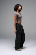Black TLF Low Rise Oversized Cargo Joggers — product video showing the low-rise waist, baggy fit and snap button cargo pockets