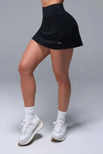Side View of Black TLF NeoCloud™ workout skirt featuring built in 2.5-inch inseam shorts and side pockets
