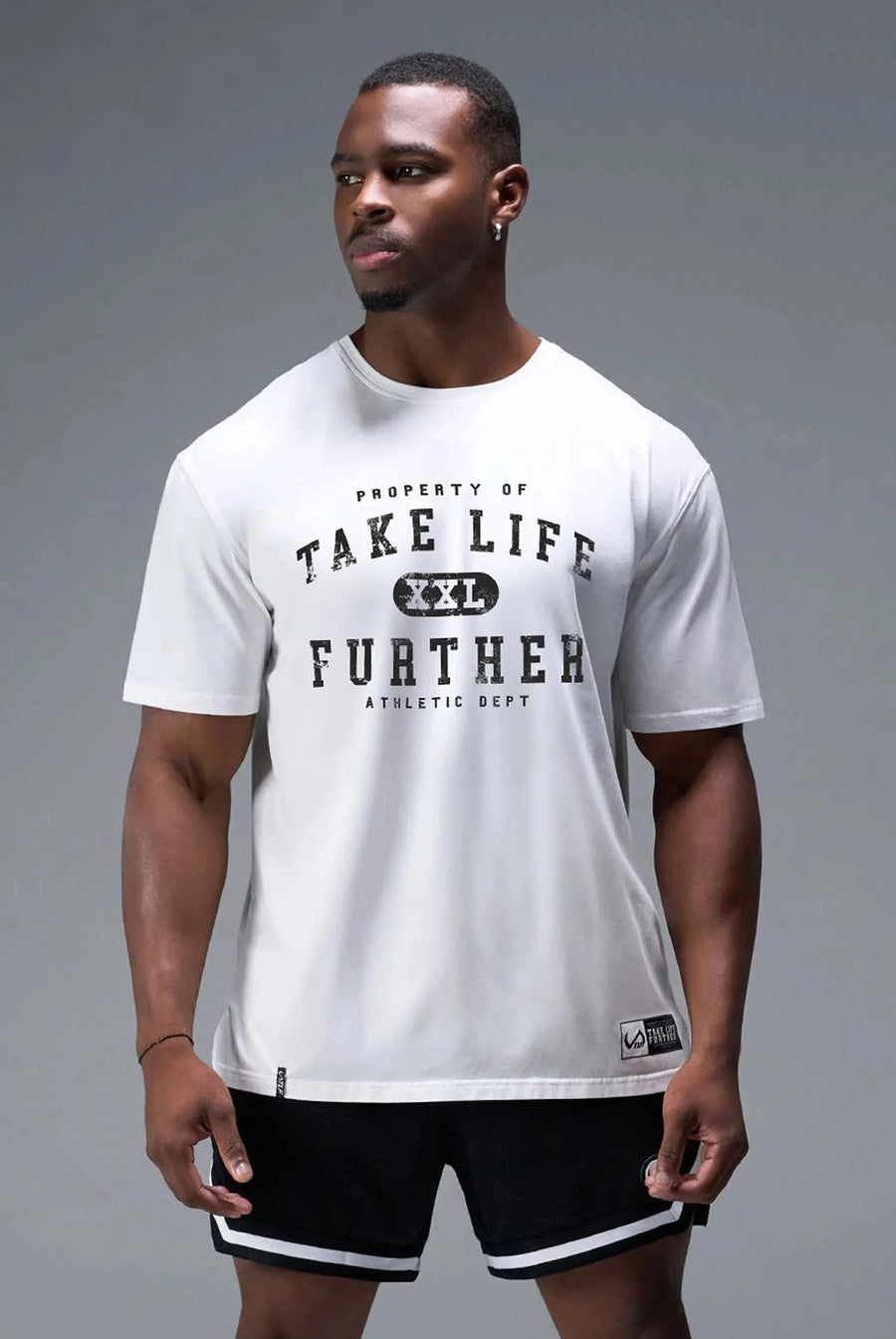 Detail Front View of White TLF Property of Cotton Luxe Oversized Tee featuring a distressed graphic print design across the chest in our oversized t shirt fit