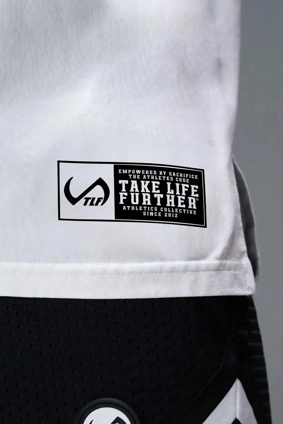 Front View of White TLF Property of Cotton Luxe Oversized Tee featuring a distressed graphic print design across the chest in our oversized t shirt fit
