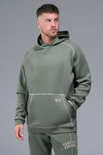 Front View of Green TLF Scuba Tech Contrast Stitch Hoodie, featuring 3 panel hood, Kangaroo pockets and contrast stitching for streetwear aesthetic 