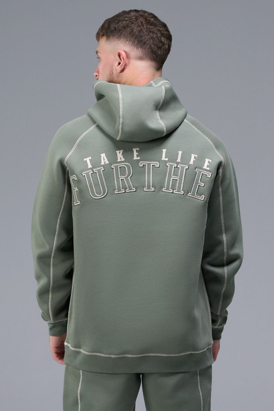 Back View of Green TLF Scuba Tech Contrast Stitch Hoodie, featuring 3 panel hood, Kangaroo pockets and contrast stitching for streetwear aesthetic 