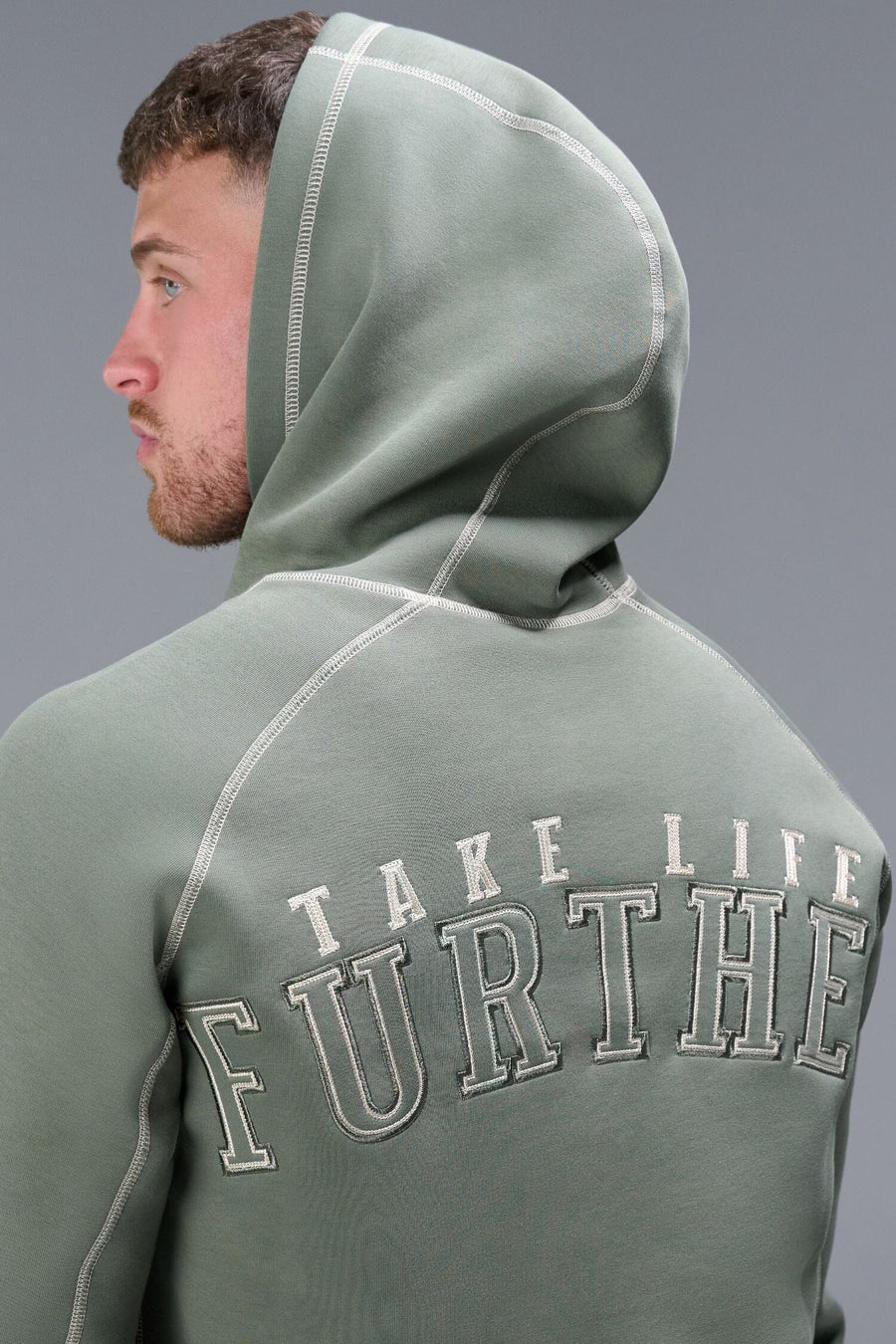 Detail Back View of Green TLF Scuba Tech Contrast Stitch Hoodie, featuring 3 panel hood, Kangaroo pockets and contrast stitching for streetwear aesthetic 