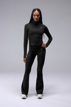 Front View of Black TLF Tempo Cropped Zip Up Jacket featuring thumbholes and cropped length for gym and lifestyle wear 