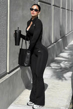 Front View of Black TLF Tempo Flare Leggings, featuring a waist snatching crossover waistband and glute shaping side seam 
