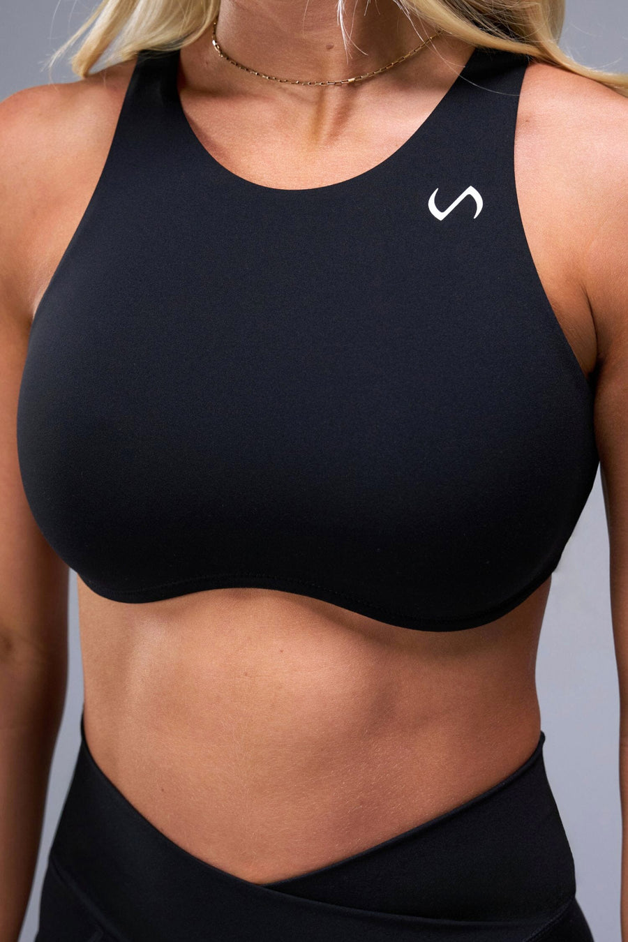 Detail Front View of Black TLF Tempo High Neck Sports Bra, featuring a high neckline for high impact support during workouts, cardio and all day wear 