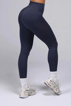 Side View Of Tempo High Waisted Workout Leggings in Armada