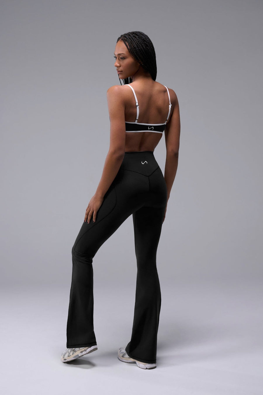 Back View of Black Tempo Minimal Bralette 2.0, featuring removable pads and adjustable straps for low impact all day wear