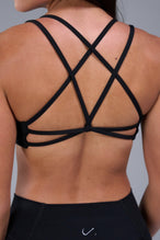 Back View of Black TLF Tempo Strappy Back Sports Bra, featuring a minimal design for the gym and lifestyle wear 