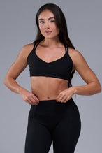 Front View of Black TLF Tempo Strappy Back Sports Bra, featuring a minimal design for the gym and lifestyle wear 