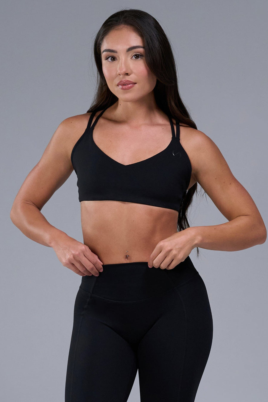 Front View of Black TLF Tempo Strappy Back Sports Bra, featuring a minimal design for the gym and lifestyle wear 