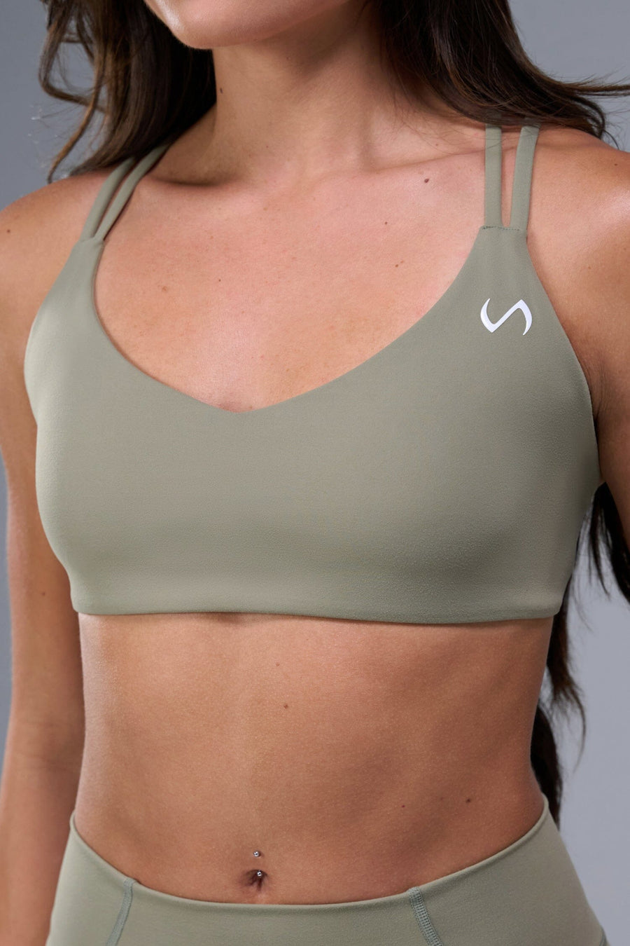 Front View of Brown TLF Tempo Strappy Back Sports Bra, featuring a minimal design for the gym and lifestyle wear 