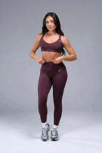 Front View of Wine TLF Tempo Strappy Back Sports Bra, featuring a minimal design for the gym and lifestyle wear 