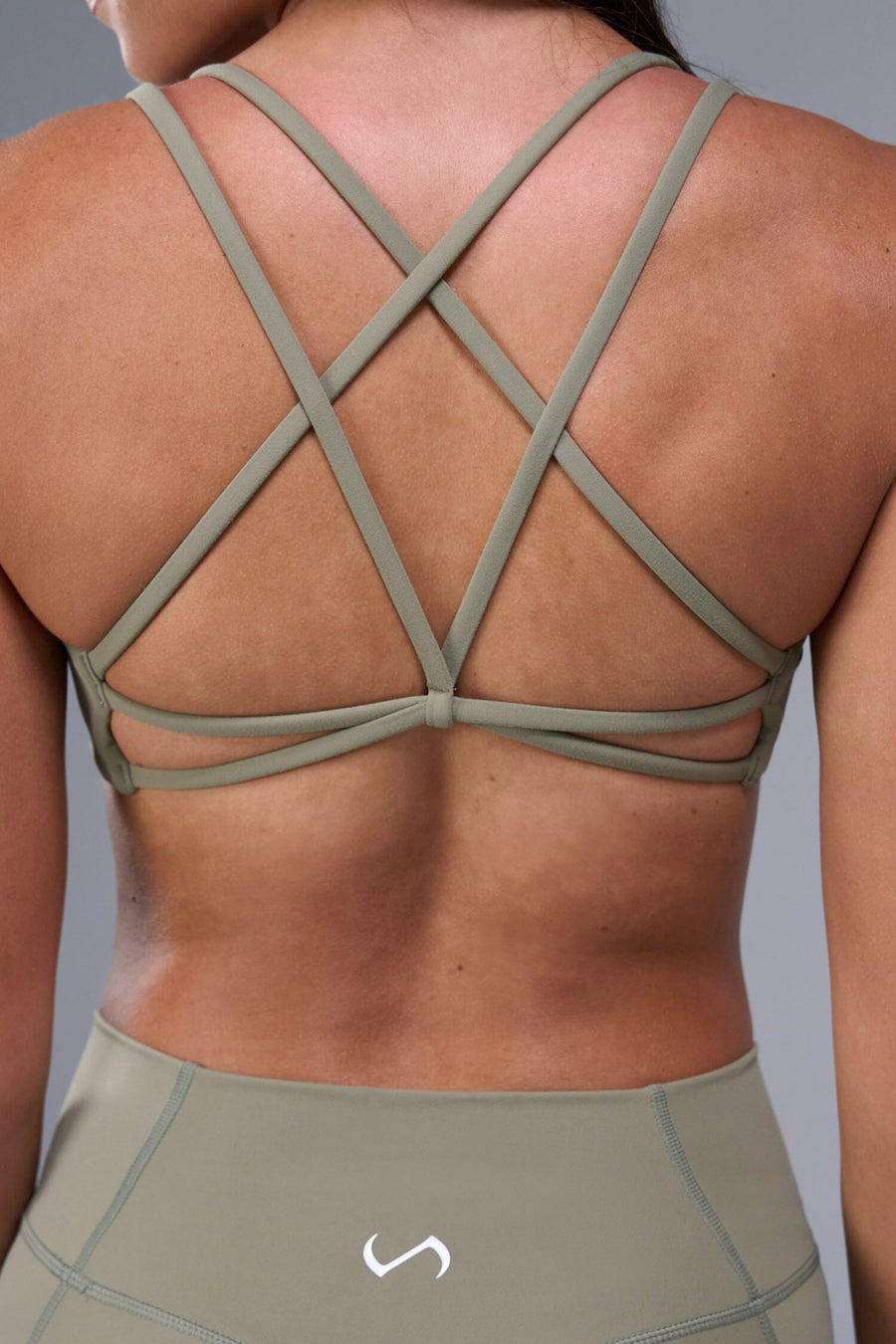 Back View of Brown TLF Tempo Strappy Back Sports Bra, featuring a minimal design for the gym and lifestyle wear 