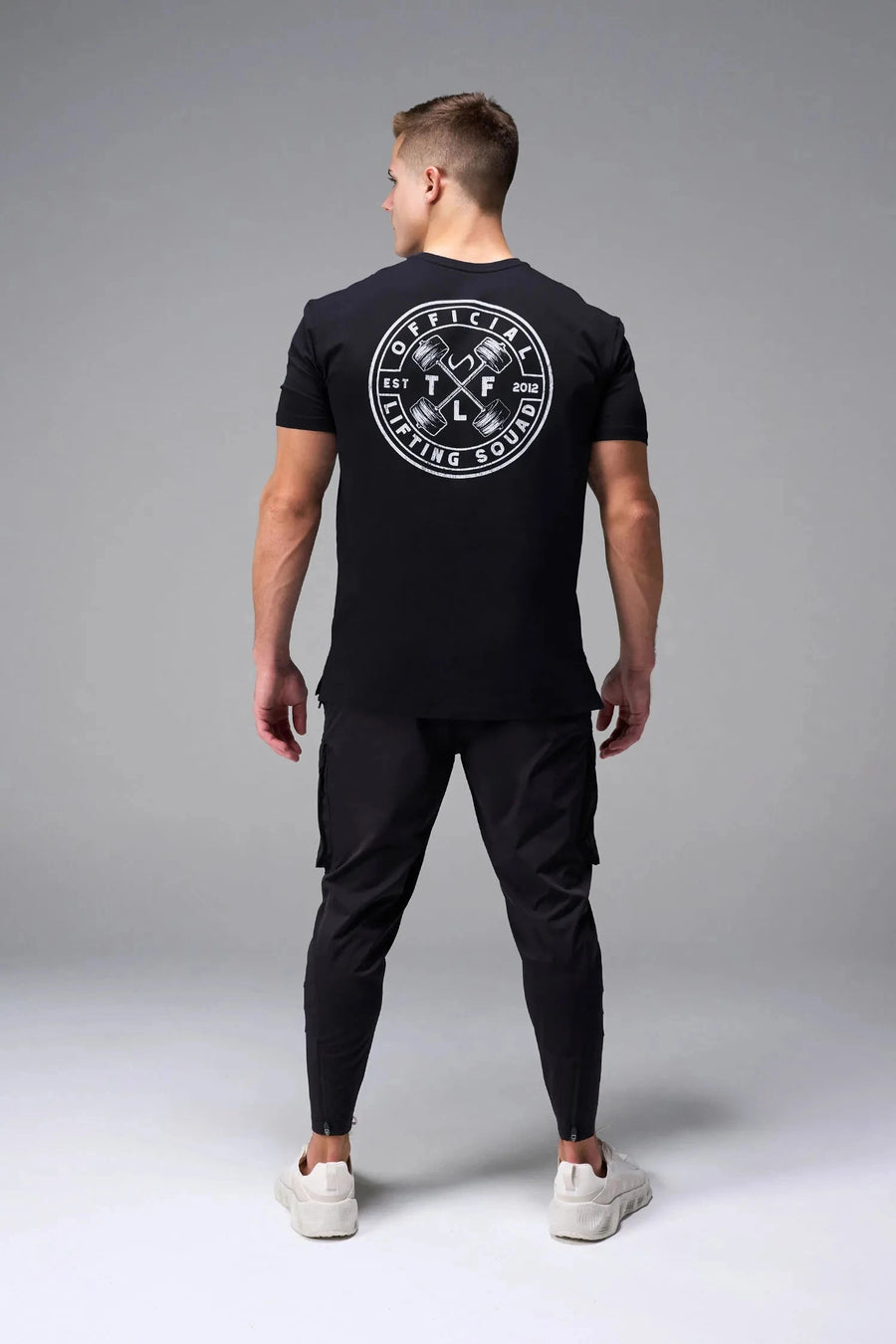 Back View of Black TLF Cross weights Swole Tee featuring our swole fit and custom graphic print design on center back