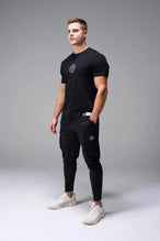 Front View of Black TLF Cross weights Swole Tee featuring our swole fit and custom graphic print design on center back