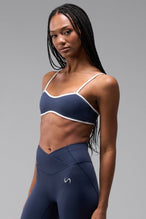 Front View of Blue Tempo Minimal Bralette 2.0, featuring removable pads and adjustable straps for low impact all day wear