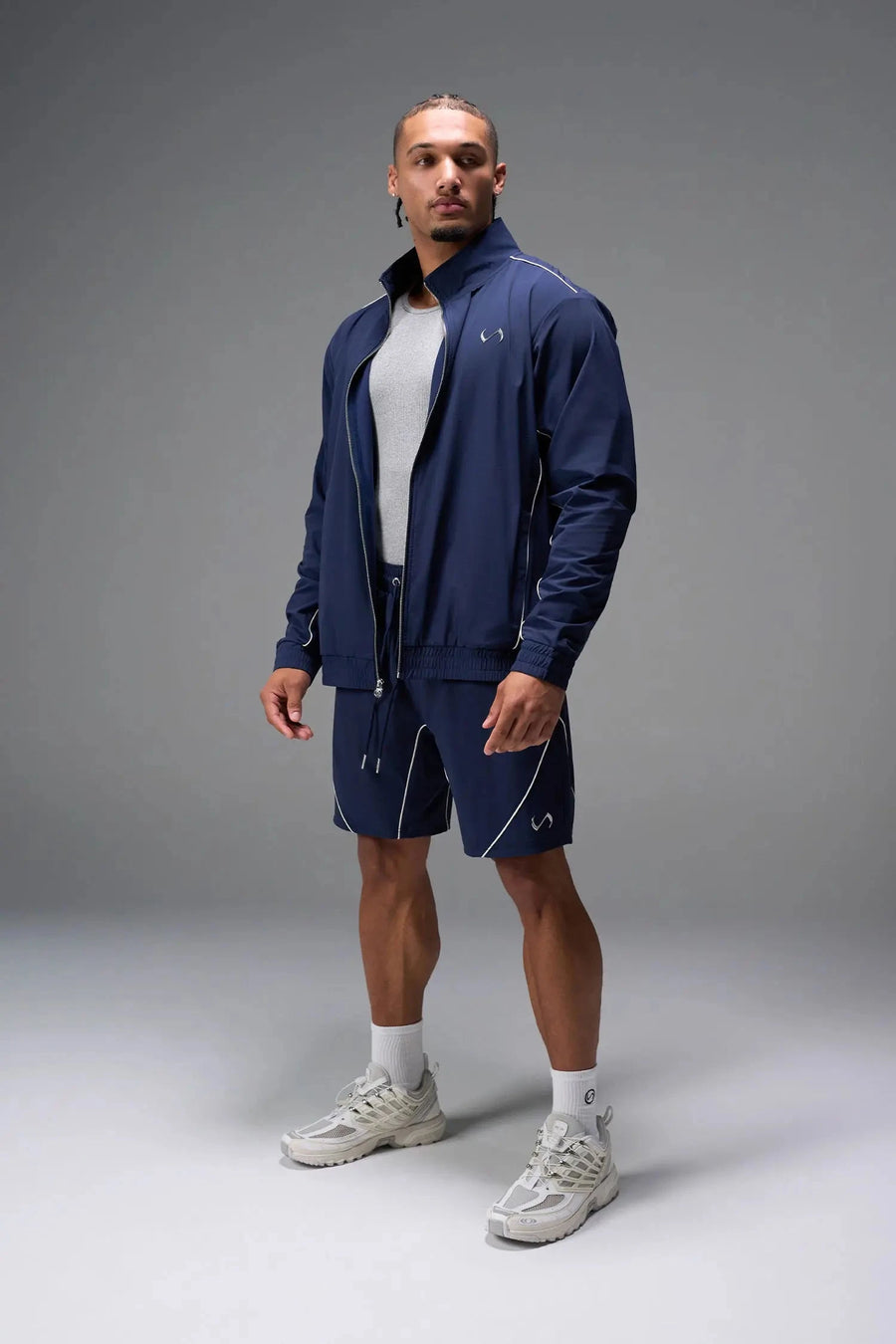 Front View of Blue TLF Track Jacket (Men’s GTS Gym-To-Street Edition) with mesh lining, reflective piping, and premium trims for all-day Gym-To-Street wear. 
