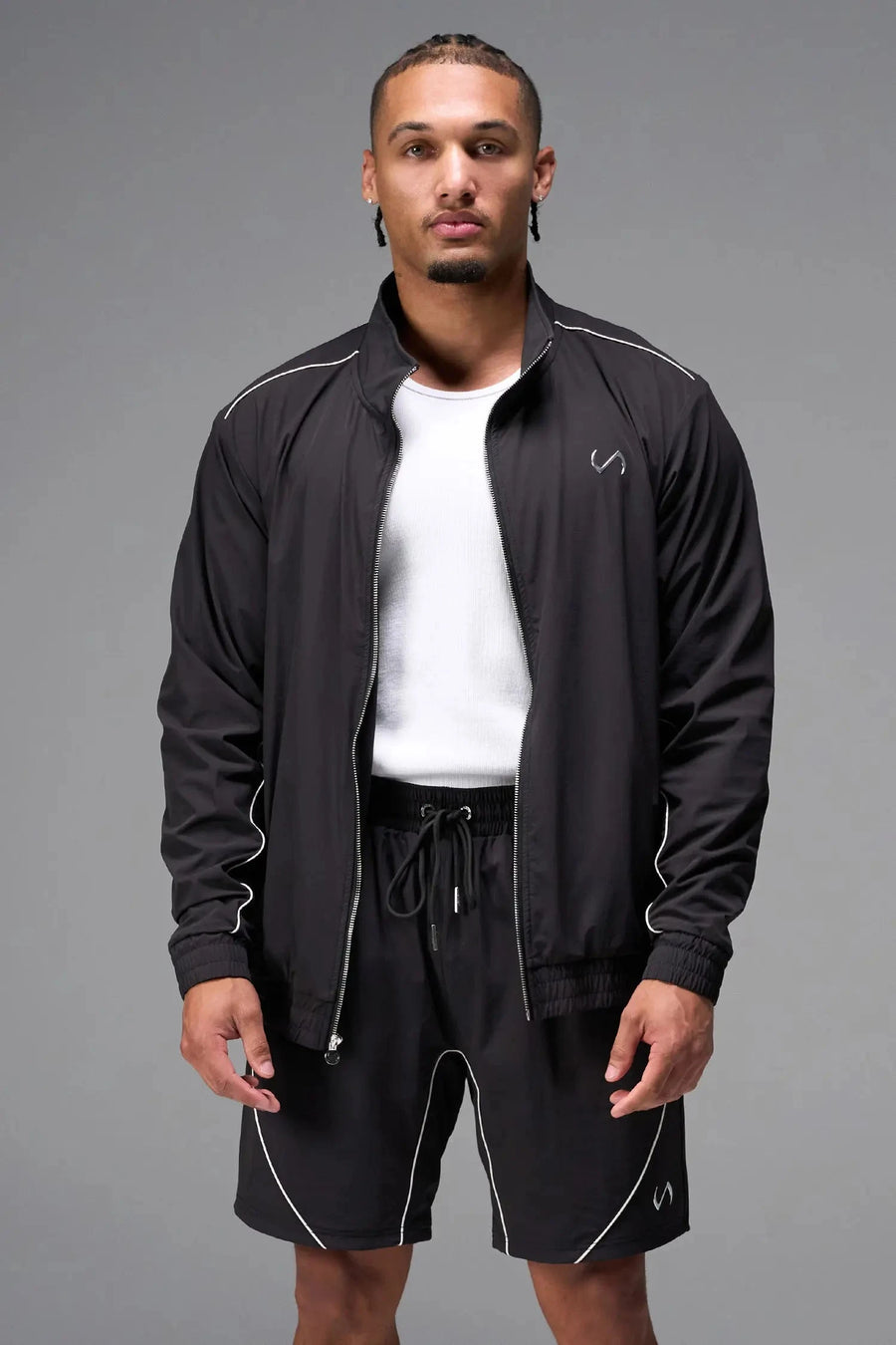 Front View of Black TLF Track Jacket (Men’s GTS Gym-To-Street Edition) with mesh lining, reflective piping, and premium trims for all-day Gym-To-Street wear. 
