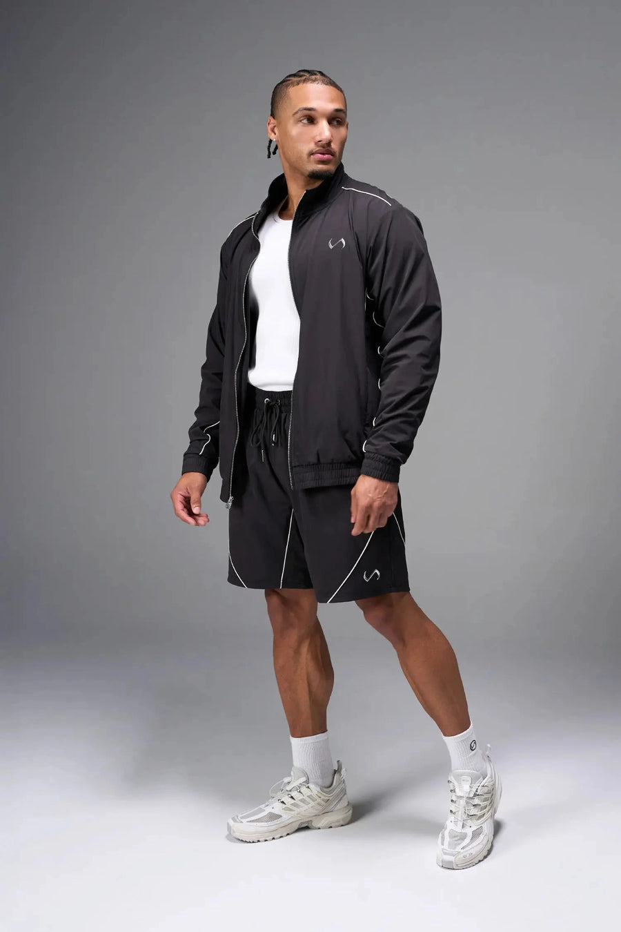 Front View of Black TLF Track Jacket (Men’s GTS Gym-To-Street Edition) with mesh lining, reflective piping, and premium trims for all-day Gym-To-Street wear. 