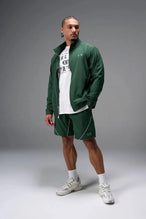 Front View of Green TLF Track Shorts (Men’s GTS Gym-To-Street Edition) featuring side zipper pockets, mesh lining and reflective piping details.