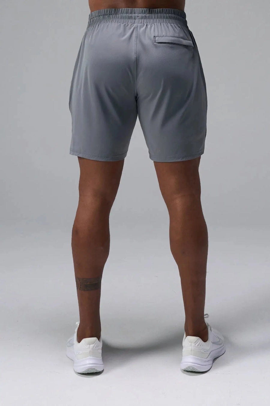Back View of Gray TLF Train Element 7 Inch Shorts featuring a 7 inch in seam and side zipper pockets designed for optimal performance