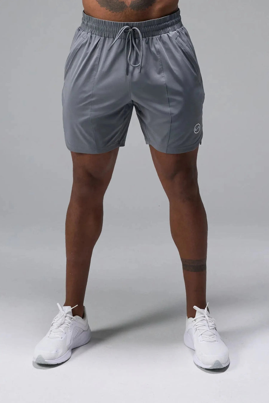 Front View of Gray TLF Train Element 7 Inch Shorts featuring a 7 inch in seam and side zipper pockets designed for optimal performance
