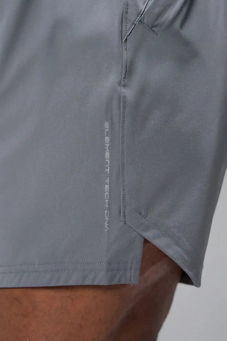 Detail Front View of Gray TLF Train Element 7 Inch Shorts featuring a 7 inch in seam and side zipper pockets designed for optimal performance
