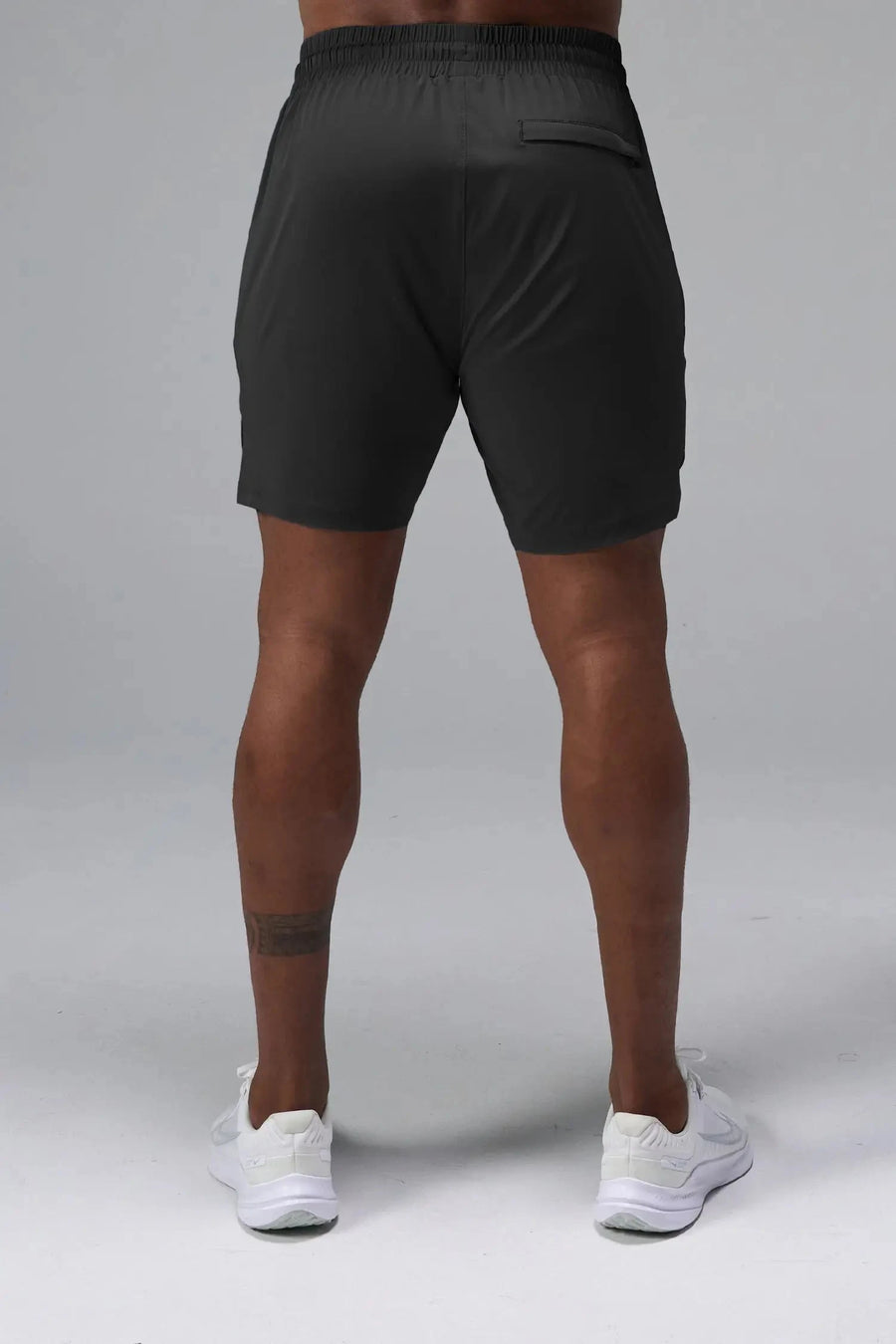 Back View of Black TLF Train Element 7 Inch Shorts featuring a 7 inch in seam and side zipper pockets designed for optimal performance