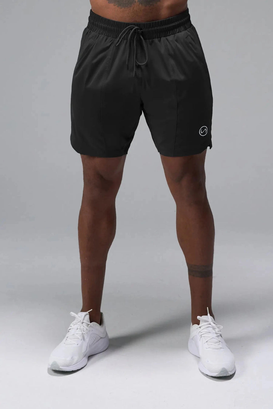 Front View of Black TLF Train Element 7 Inch Shorts featuring a 7 inch in seam and side zipper pockets designed for optimal performance