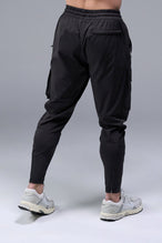 Black TLF Train Element 7/8 Cargo Joggers 2.0 — product video showing the cargo pockets, side zipper pockets and 7/8 length